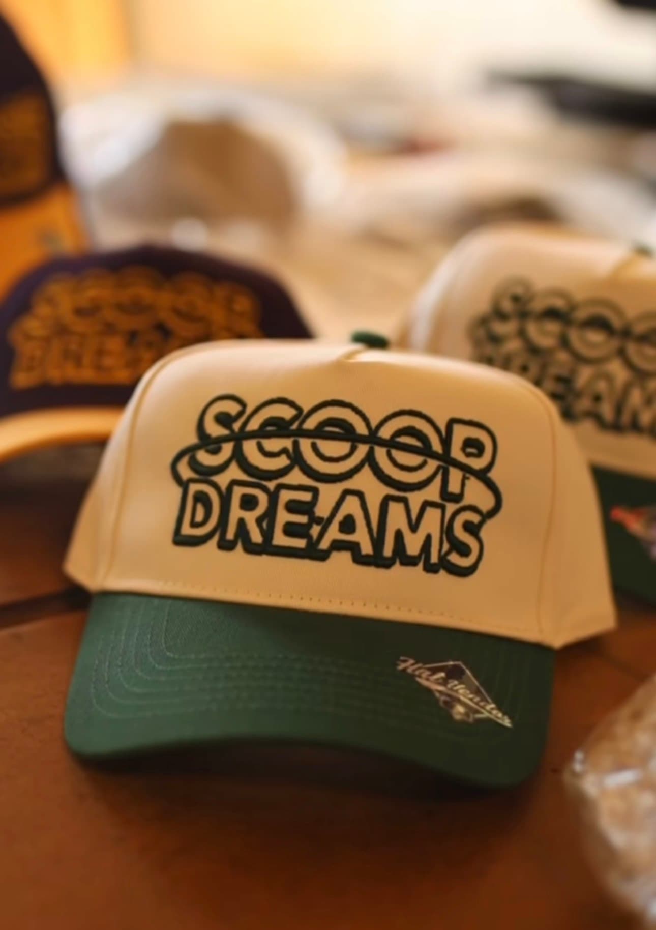 Scoop Dreams branded trucker hats stacked together