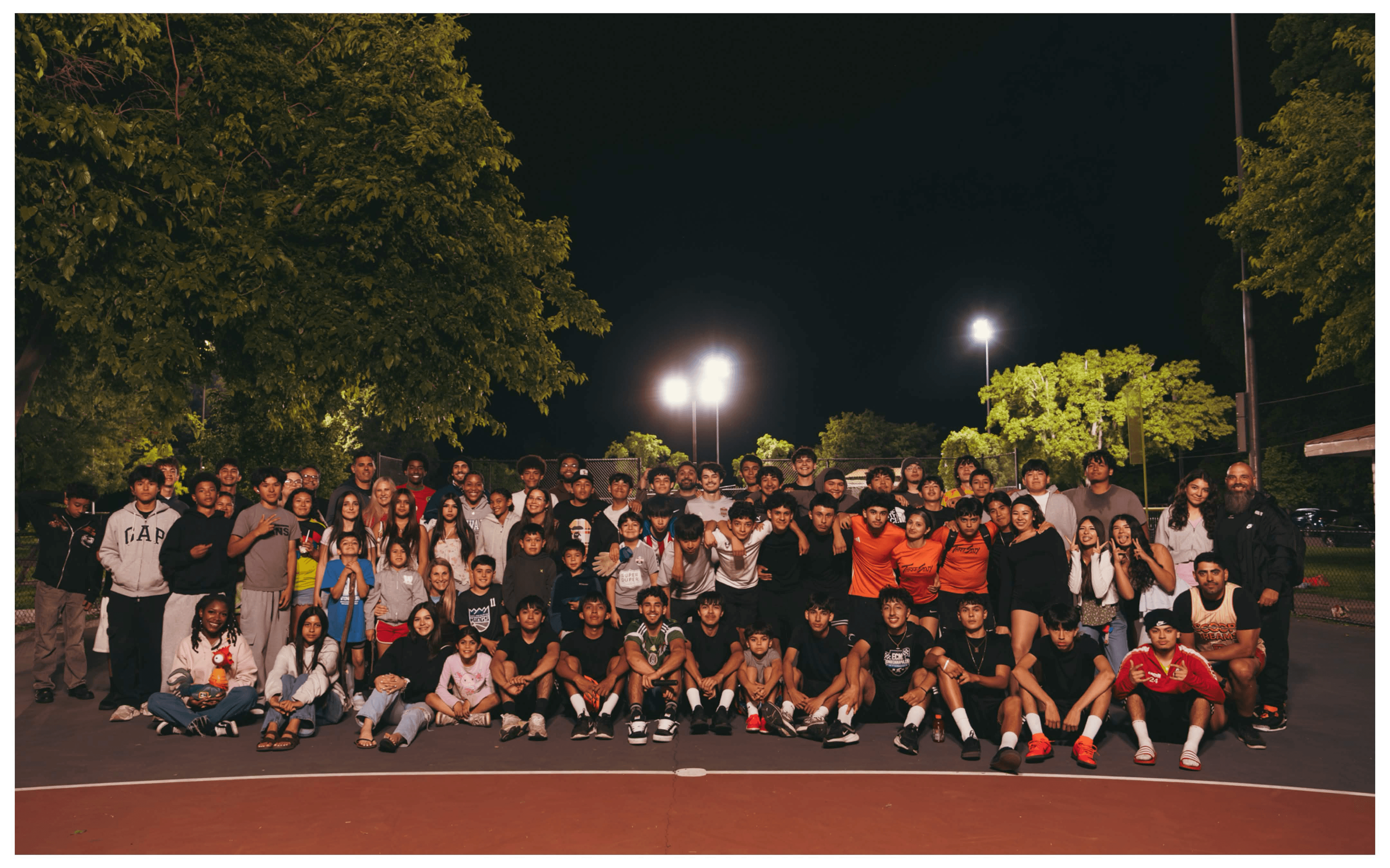Group photo of attendees at the Scoop Dreams 3-on-3 basketball tournament
